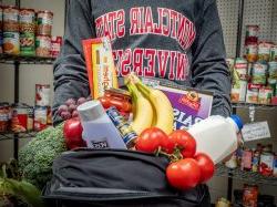 Student with food from the pantry