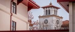 view of the bell tower between buildings